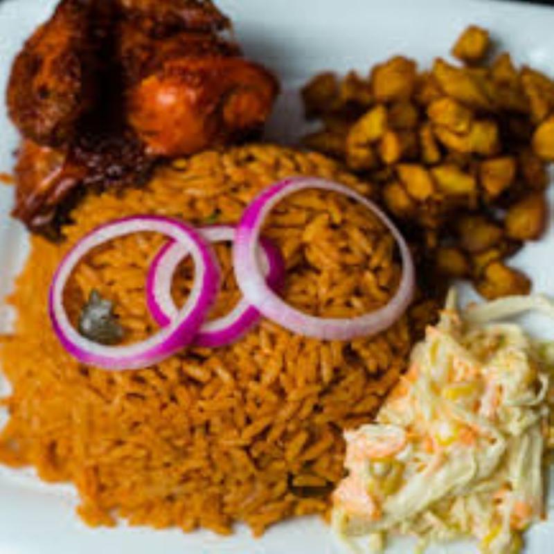 Jollof Rice, salad, plantain, and Beef